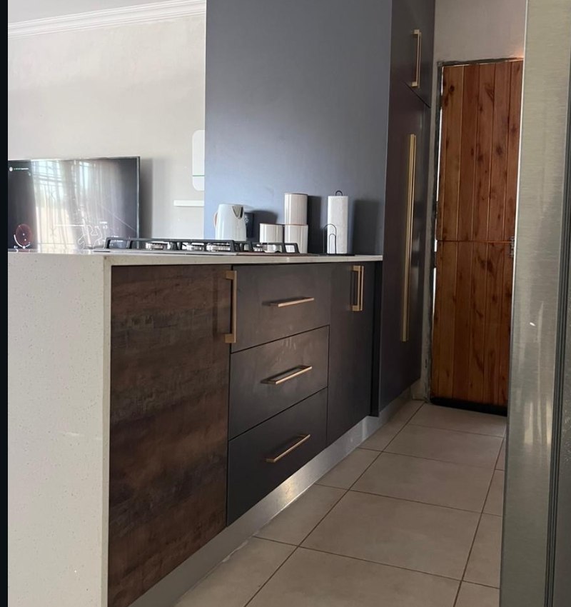Kitchen renovation — galley kitchen with dark cabinetry
