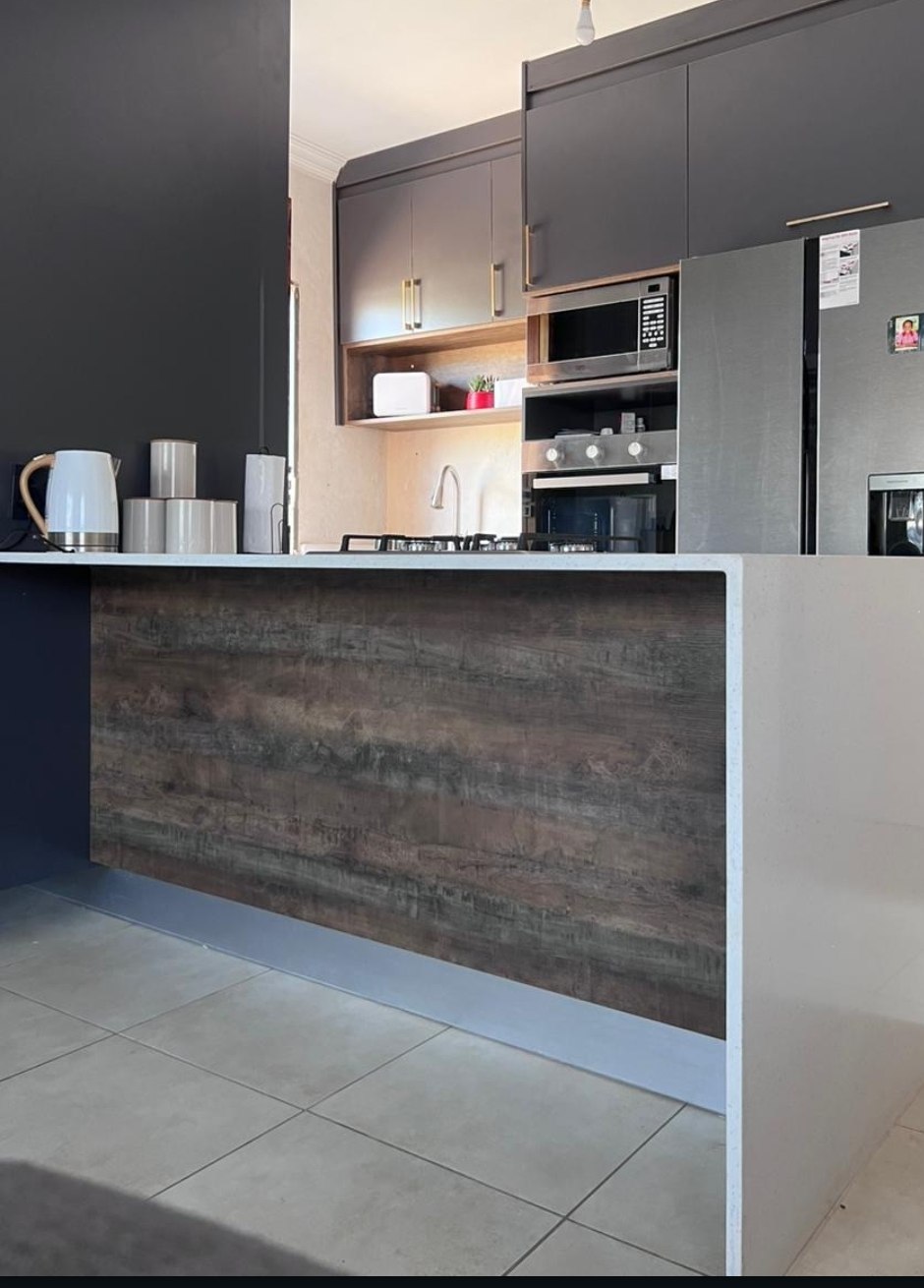 Kitchen island renovation with integrated appliances